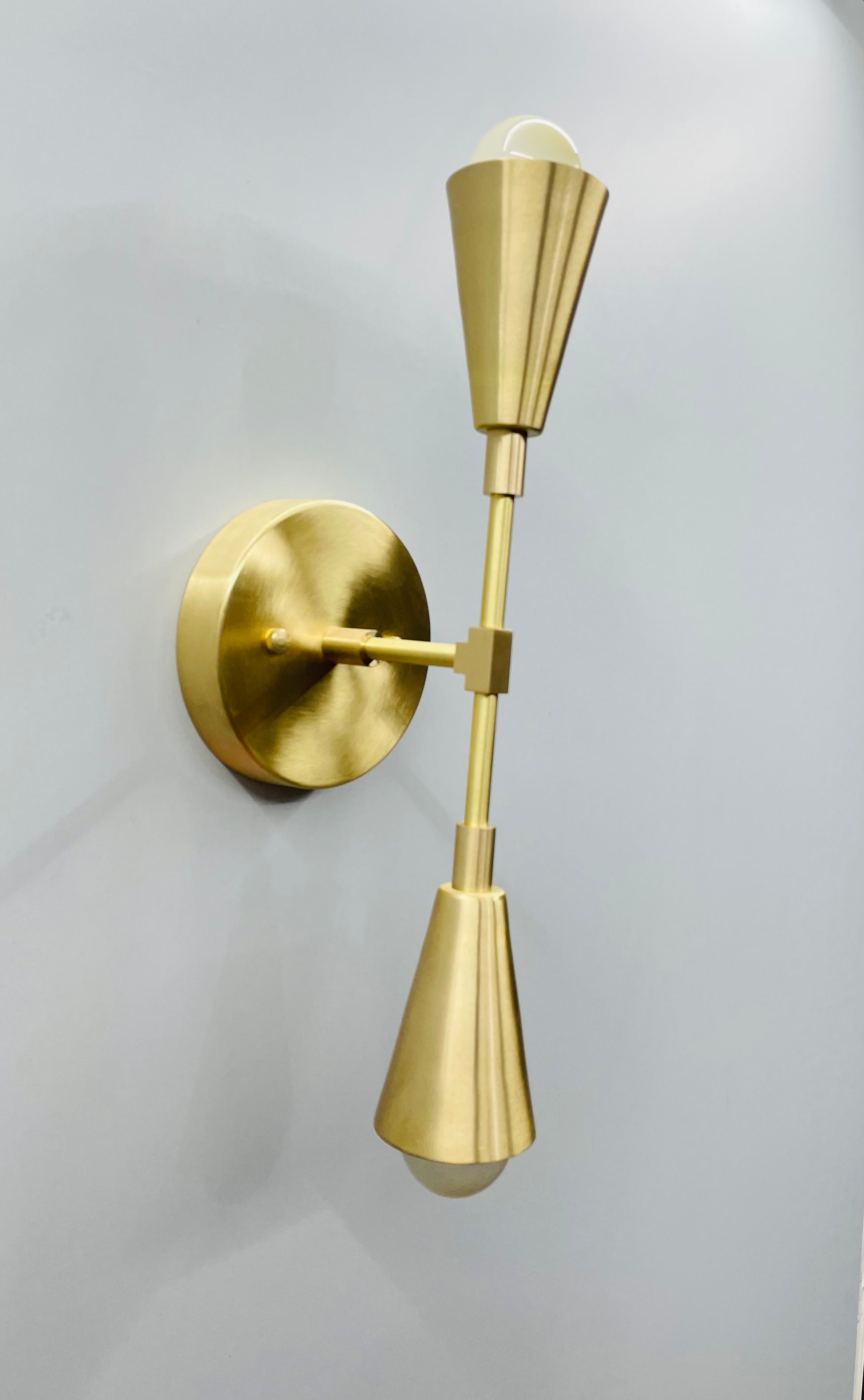 Captivating Double Cone Wall Sconce - Handcrafted Brass Construction